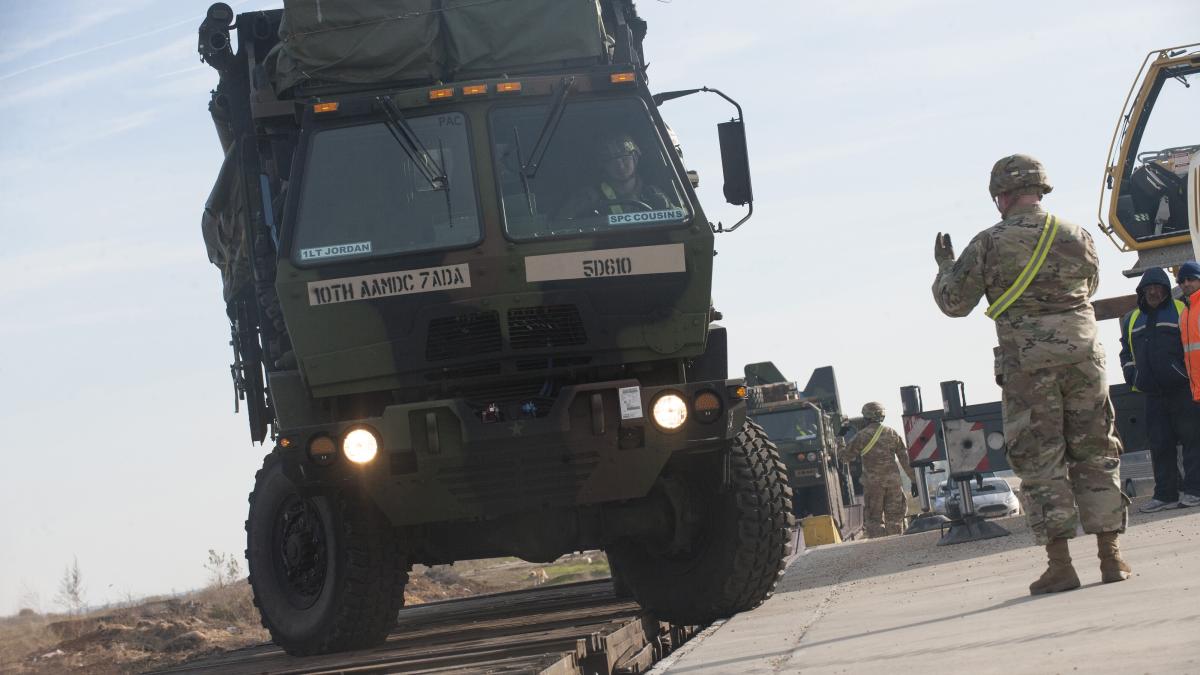 5th-battalion-7th-air-defense-artillery-regiment--transports-a-military-support-vehicle-off-a-railroad-flatbed-during-a-patriot_90393900