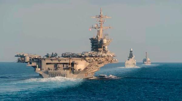 Portavionul USS Abraham Lincoln, hărțuit în strâmtoarea Hormuz de nave ale Gărzii Revoluționare Iraniene 