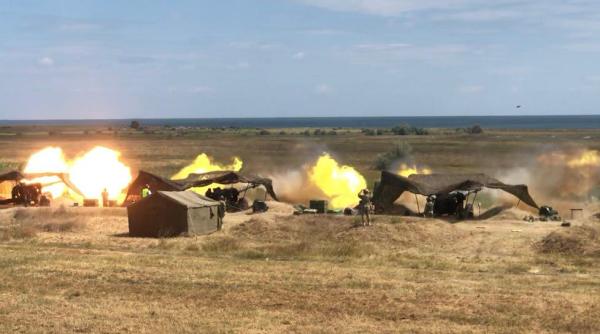 Artileria grea, în acțiune. Tunurile și obuzierele române au provocat un incendiu de vegetație